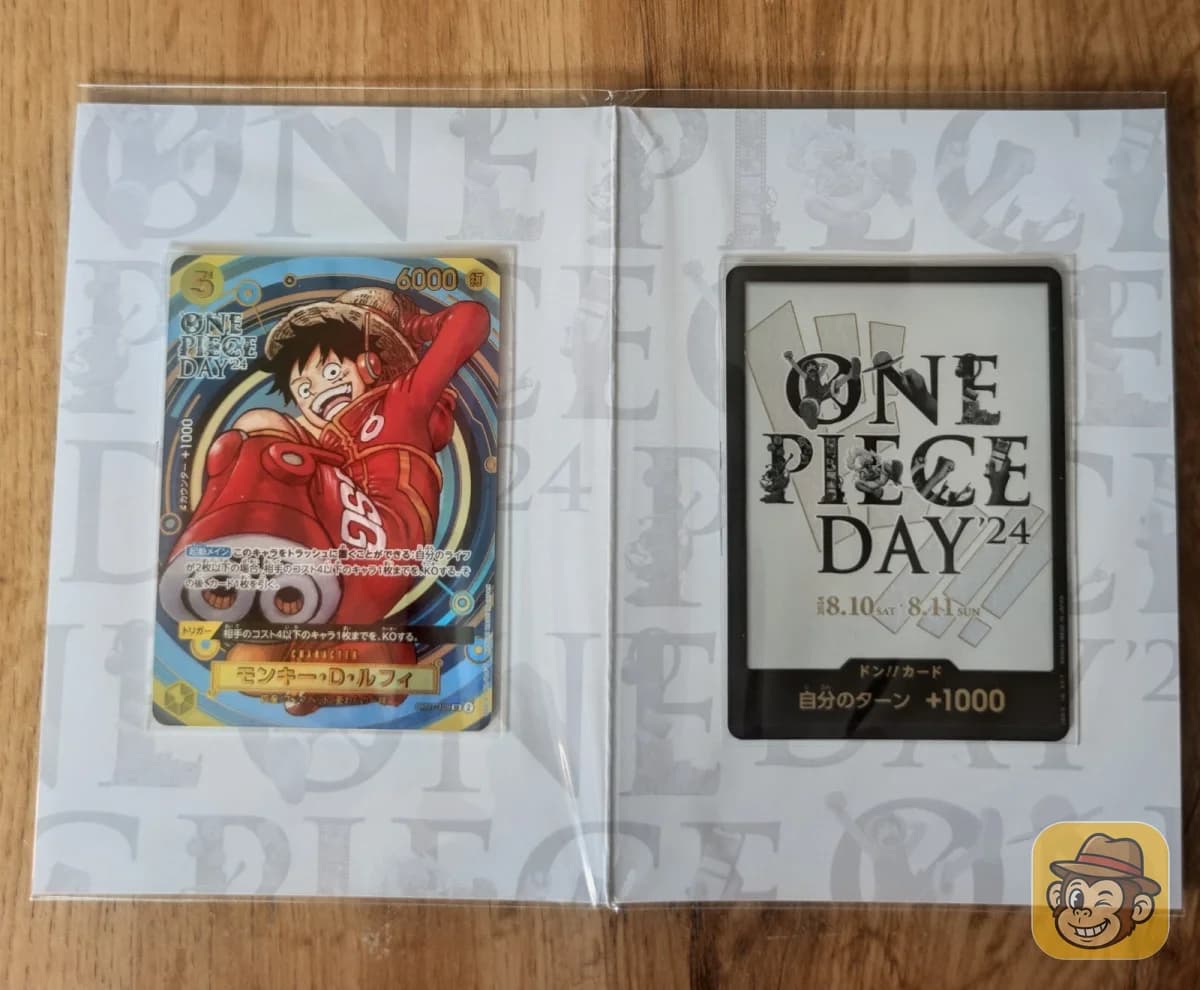 Carpeta abierta de la Premium Card Collection ONE PIECE DAY'24 con el Luffy parallel y la carta DON!!